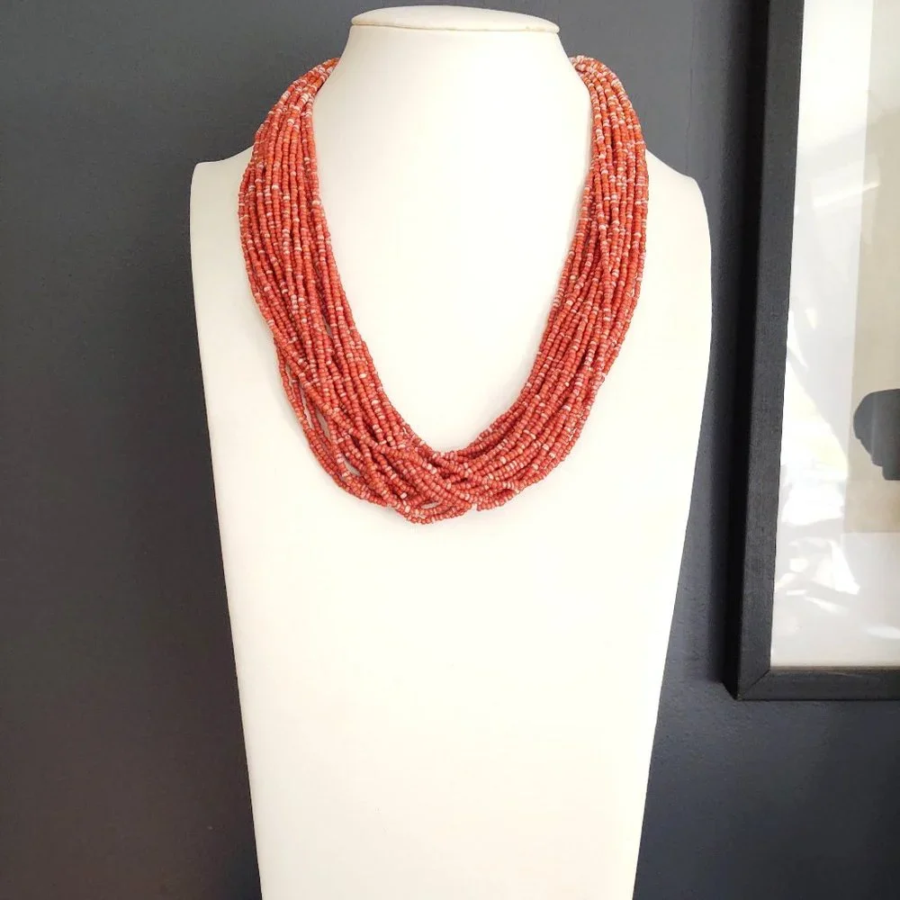 Orange and white multi strand seed bead necklace